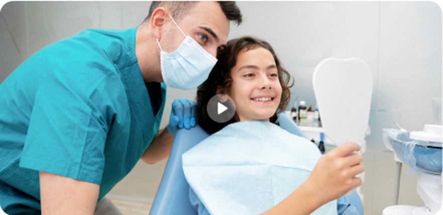 Dentist helping a young patient feel comfortable